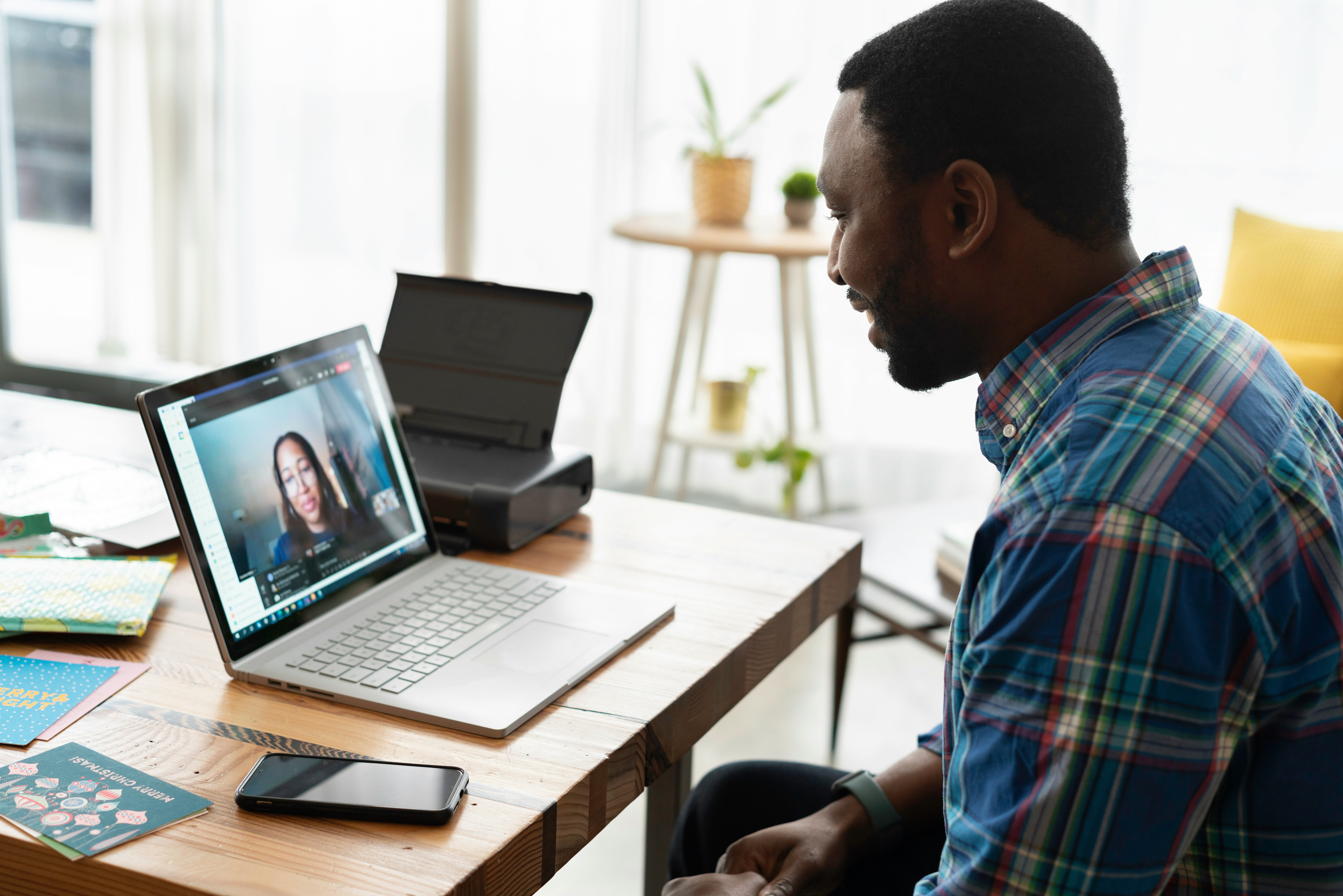 A person in a peaceful home setting on a video session with their therapist